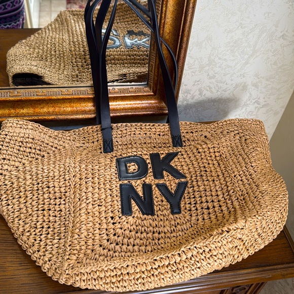 - New DKNY Paloma Tote. Nice large bag with DKNY letters on the front.